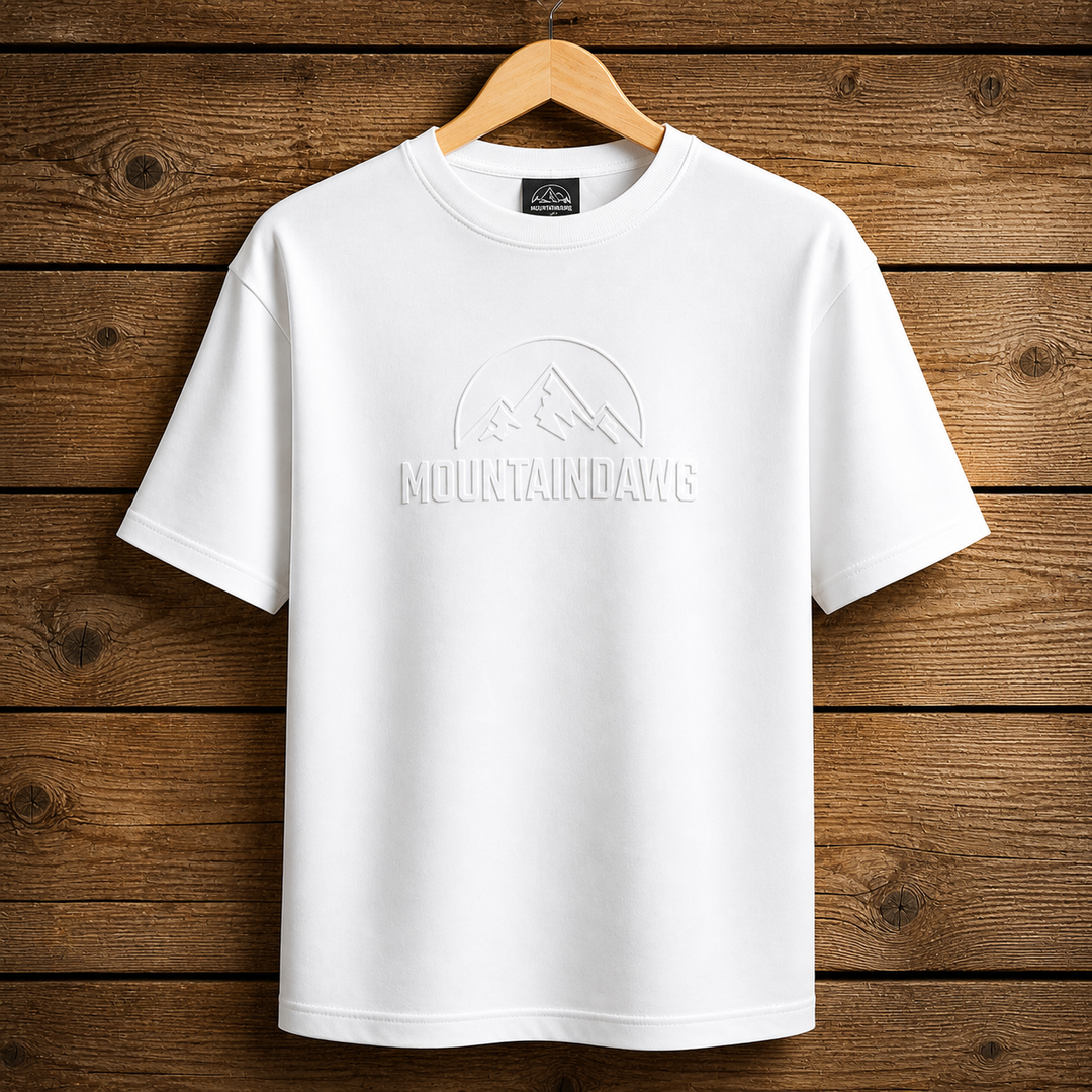 Mountain Dawg Iconic Embossed Tee in Classic White — hero shot oversized fit | Mountain Dawg